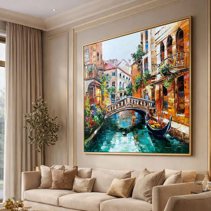 Living room with a large painting of a Venice canal scene on the wall.