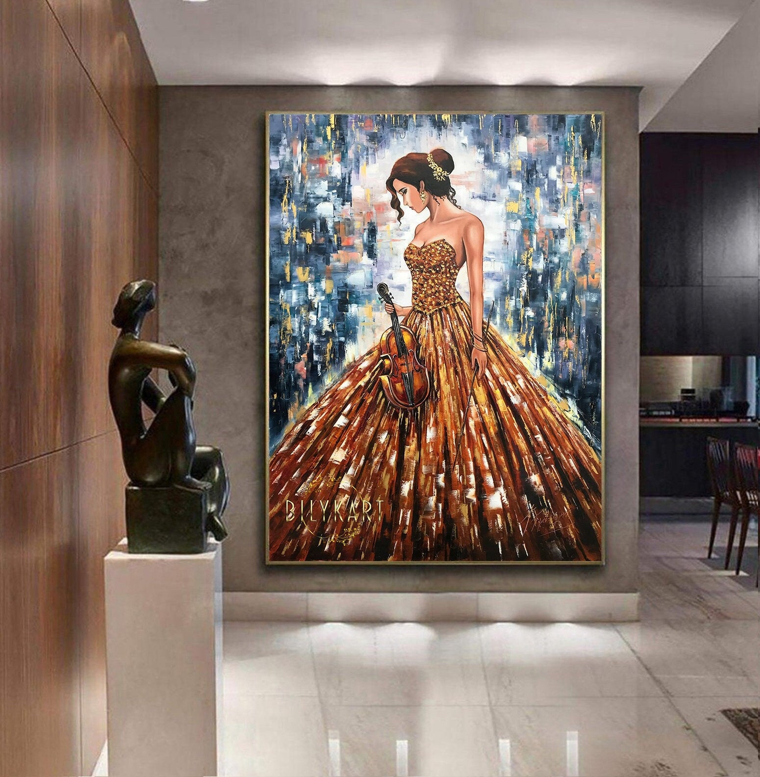 May include: A painting of a woman in a gold dress holding a violin. The background is a colorful abstract design with shades of blue, gold, and white. The painting is signed 'Dilykart' in the bottom left corner.
